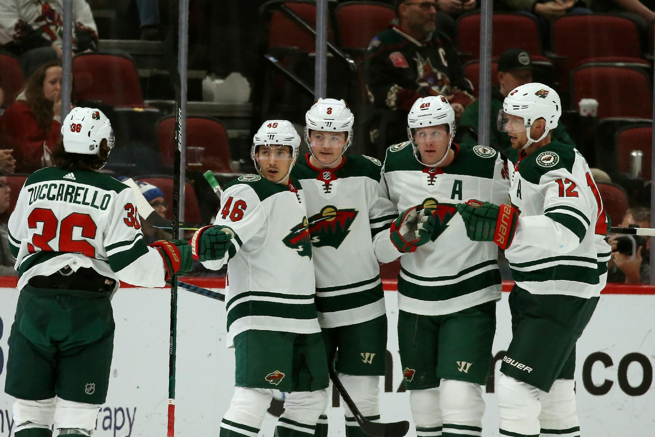 Minnesota Wild center Ryan Donato (6) celebrates his goal against the Arizona Coyotes with right wing Mats Zuccarello (36), defenseman Jared Spurgeon (46), defenseman Ryan Suter (20) and center Eric Staal (12) during the second period of an NHL hockey game Thursday, Dec. 19, 2019, in Glendale, Ariz. (AP Photo/Ross D. Franklin)