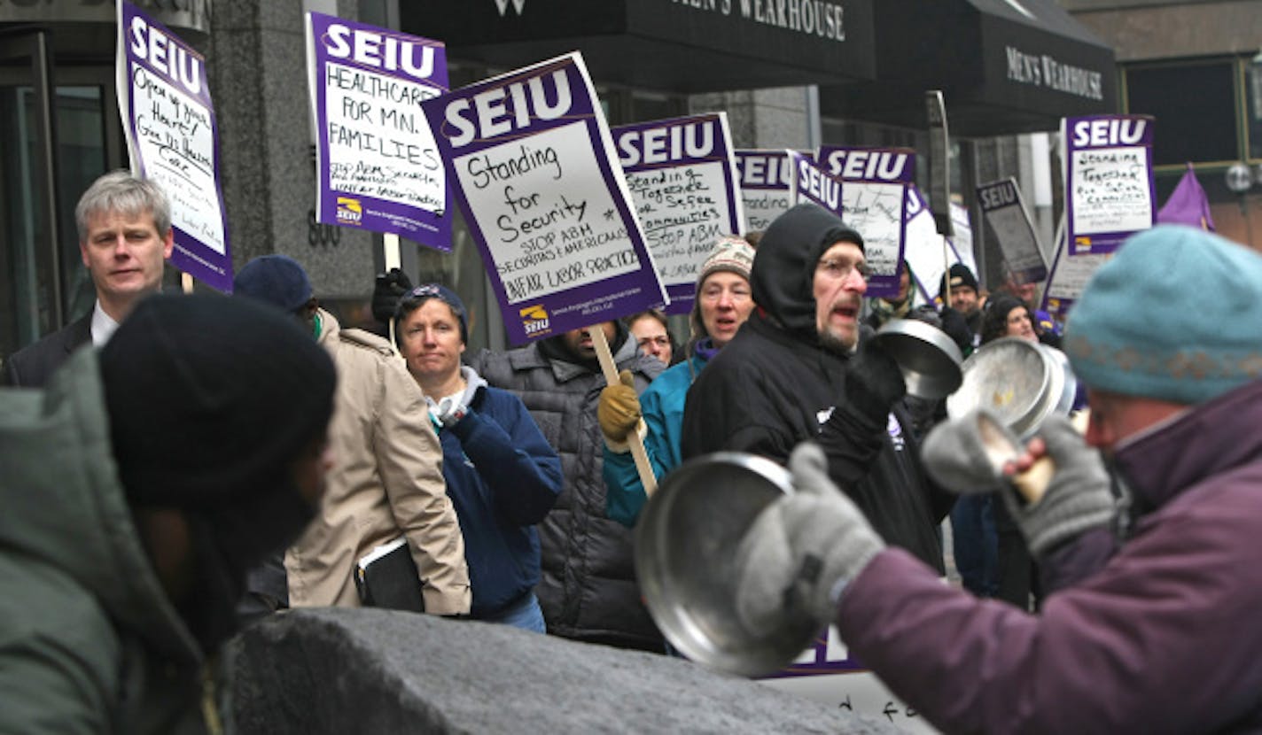 Several hundred members of SEIU Local 26 Twin Cities Secruity Officers pounded on pots, pans, drum and anything else that would make noise as they picketed infront of the U.S. Bankcorp Center near 8th and Nicollet Mall in downtown Minneapolis. The group is protesting over what they say are unfair labor practices and not bargining in good faith for a new contract.