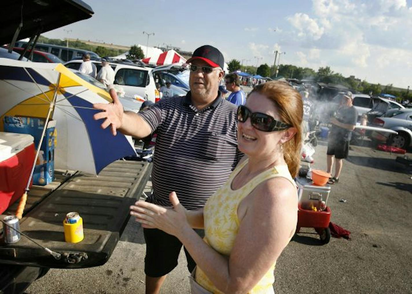 Jake and Teresa Mauer, parents of Minnesota Twins catcher Joe Mauer, tailgate in the Miller Park parking lot before the Twins 7-3 win over the Milwaukee Brewers at Miller Park in Milwaukee.