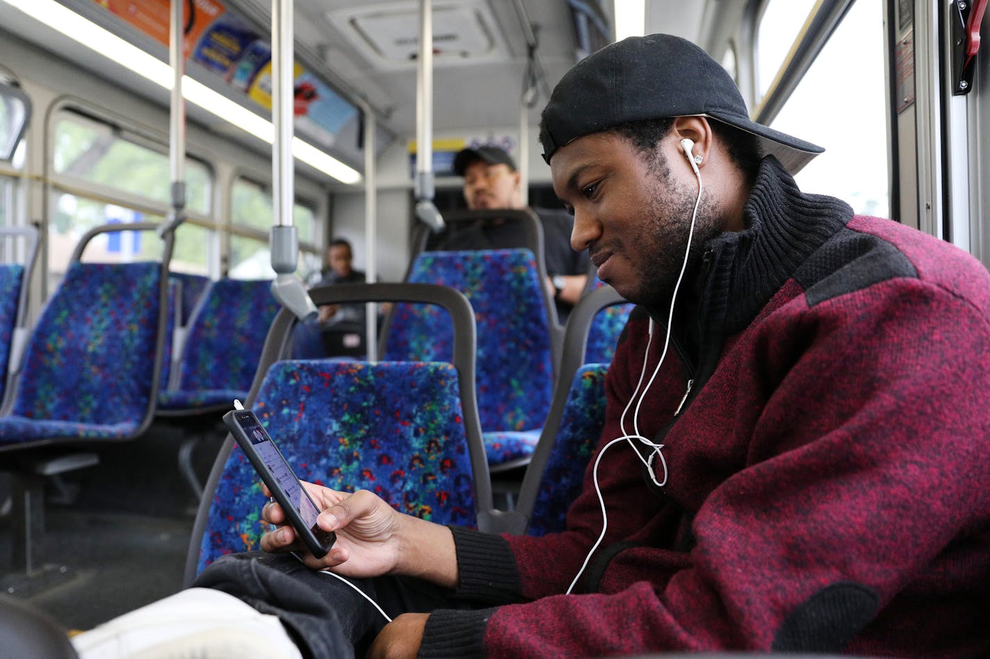 Andre Harris listened to music as he rode the Route 5 bus on his way to his job at the Mall of America. ] ANTHONY SOUFFLE &#xef; anthony.souffle@startribune.com Andre Harris rode the Route 5 bus on his way to his job at the Mall of America Tuesday, June 19, 2018 in Minneapolis. The Route 5 bus, the most-heavily used bus corridor in the state which bisects the heart of Minneapolis, was slated for an much-needed upgrade in the next two years. Transit planners had hoped to re-craft the route into a