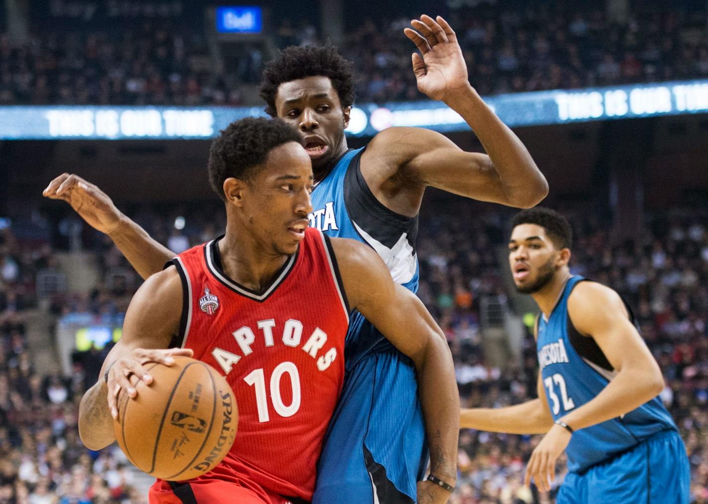 Toronto Raptors guard DeMar DeRozan (10) drives past Minnesota Timberwolves guard Andrew Wiggins (22) during the first half of an NBA basketball game, Wednesday, Feb. 24, 2016 in Toronto. (Nathan Denette/The Canadian Press via AP) MANDATORY CREDIT