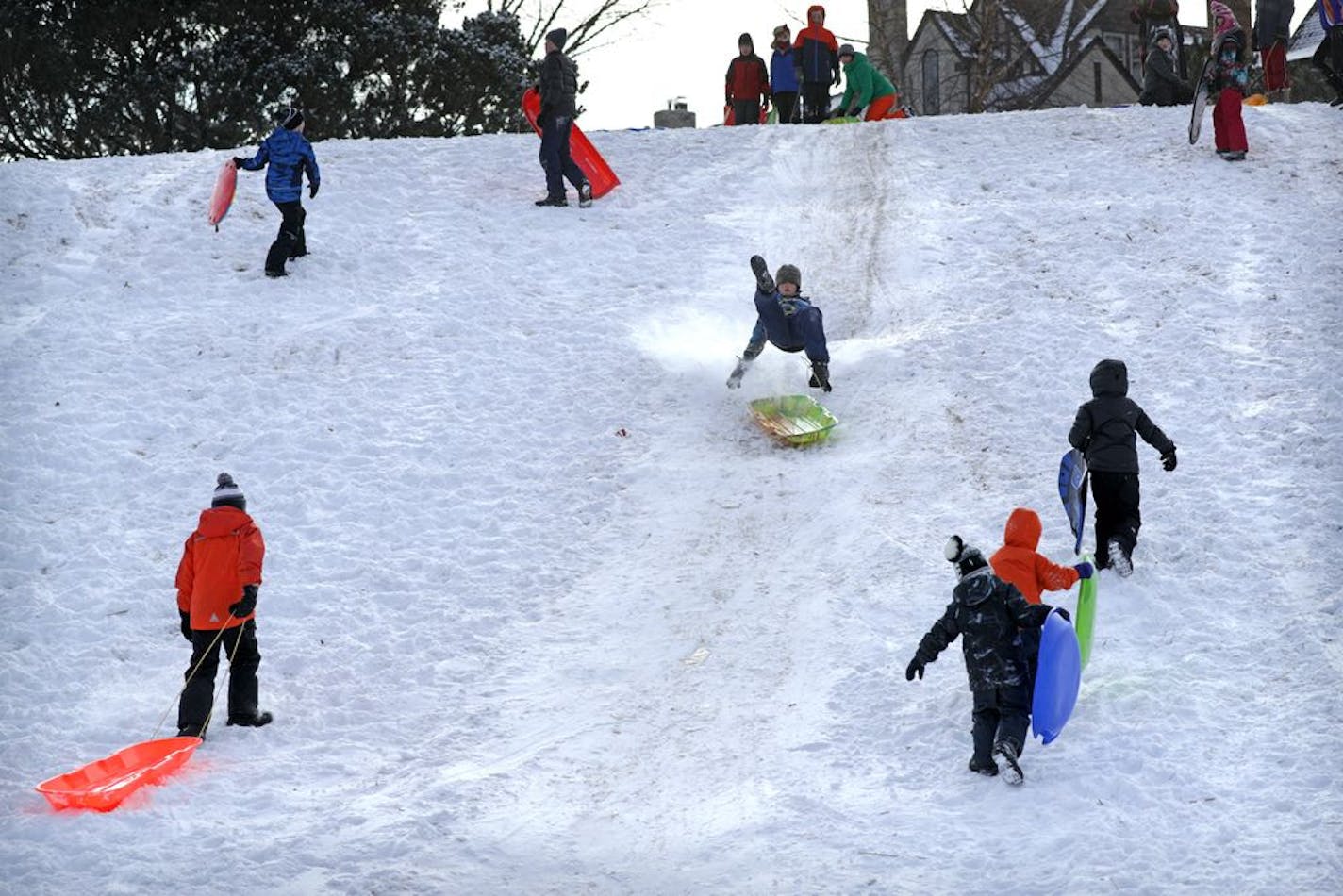 Nothing like a good old fashioned Snow Day to get kids outside. The hill along Minnehaha Creek near Cedar Ave. and 49th Street was a sledders paradise Monday afternoon with a fresh coat of snow and temps still above zero.