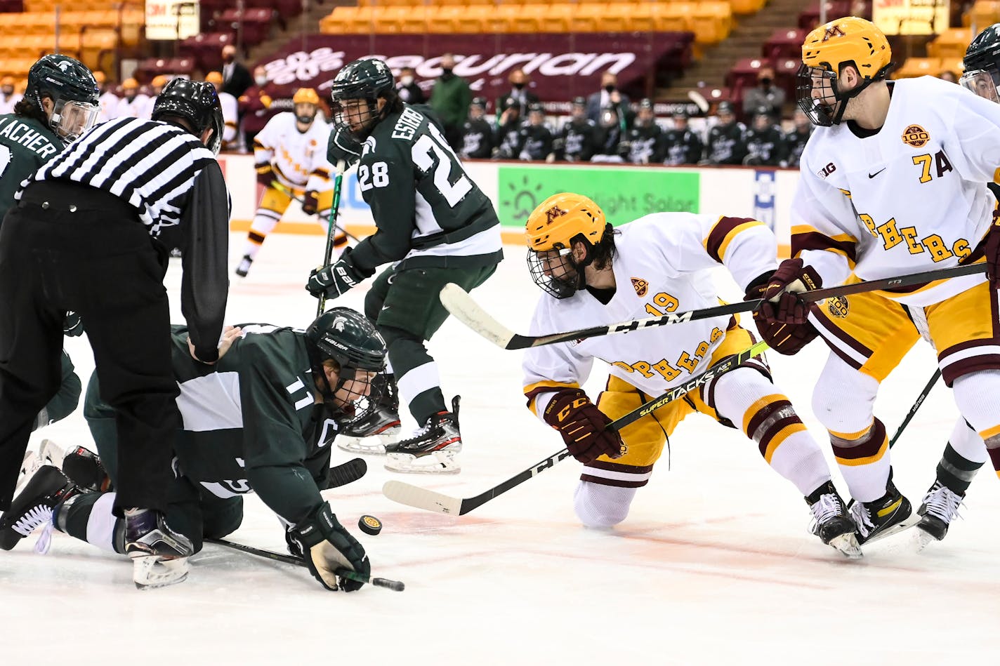 Minnesota Gophers forward Scott Reedy (19) and Michigan State forward Tommy Apap (11) battled for the puck after a face off in the first period. ] AARON LAVINSKY • aaron.lavinsky@startribune.com