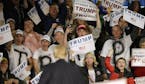 Supporters react as Republican presidential candidate Donald Trump speaks during a campaign rally, Saturday, Dec. 5, 2015, in Davenport, Iowa. (AP Pho