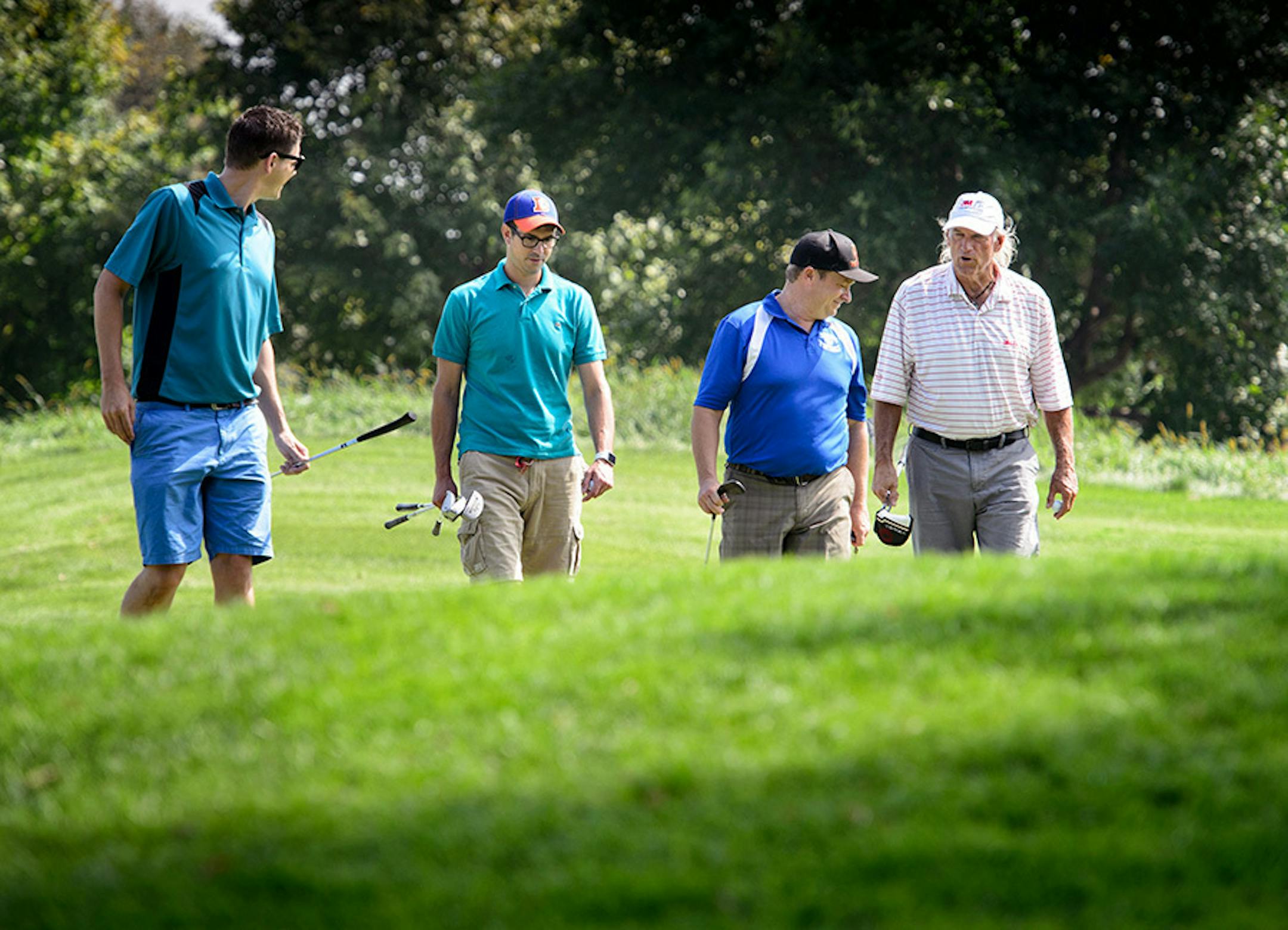 Former Minnesota Governor Jesse Ventura with guests Mike Boeve, Matthew Goeden and Brian Whipps.
