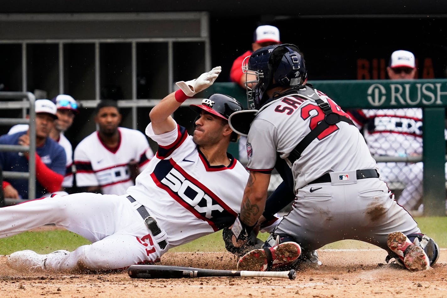 Chicago White Sox's Adam Haseley, left, is tagged out by Minnesota Twins catcher Gary Sanchez during the seventh inning of a baseball game in Chicago, Sunday, Sept. 4, 2022. (AP Photo/Nam Y. Huh)