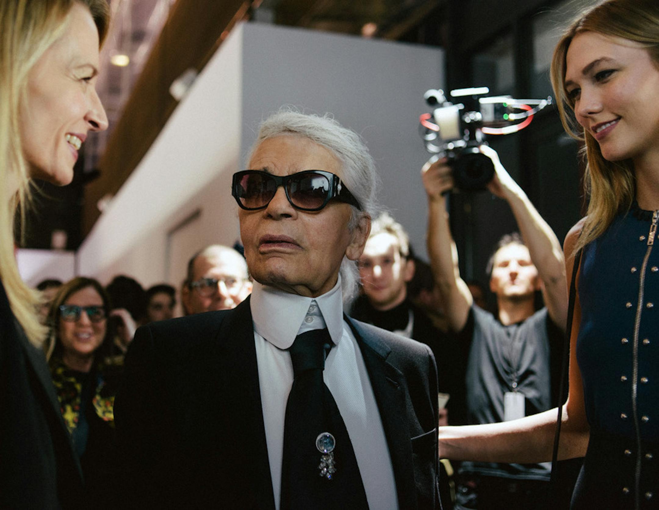 FILE -- Karl Lagerfeld speaks with Louis Vuitton Executive Vice President Delphine Arnault, left, and the model Karlie Kloss at a cocktail reception in Paris on March 2, 2016. Lagerfeld, the most prolific designer of the 20th and 21st centuries and a man whose career formed the prototype of the modern luxury fashion industry, died on Feb. 19, 2019, in Paris. He was 85. (Dmitry Kostyukov/The New York Times)