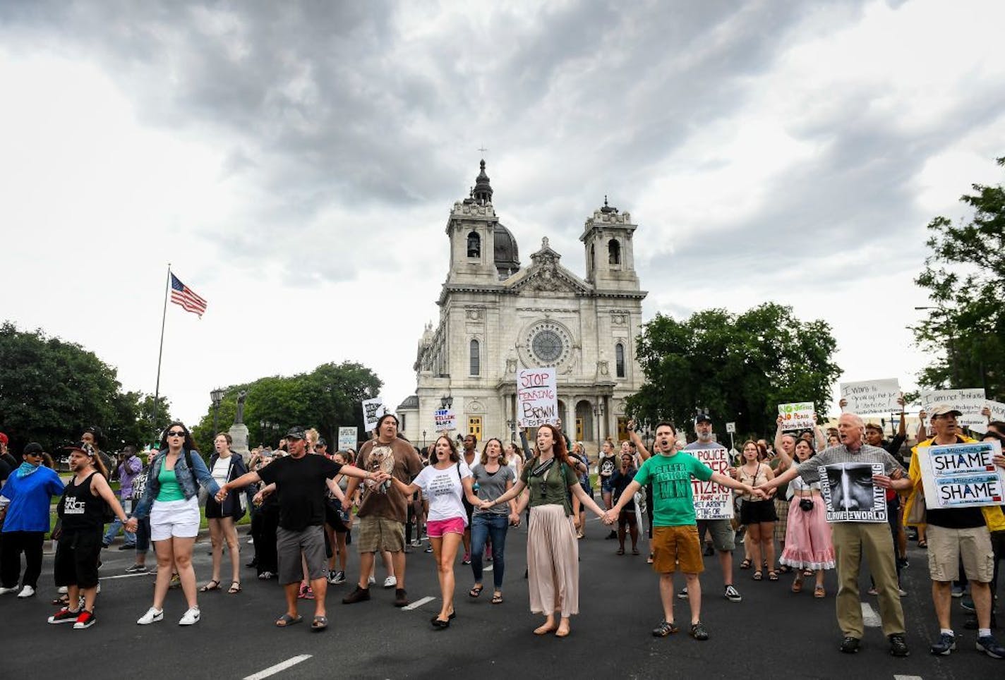 Demonstrators left Loring Park in Minneapolis after a rally Saturday and headed to the offramp from Interstate 94 to Hennepin Avenue.