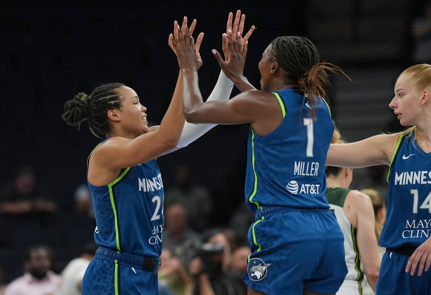 Minnesota Lynx forward Napheesa Collier (24) celebrates with Minnesota Lynx guard Diamond Miller (1) and Minnesota Lynx forward Dorka Juhasz (14) after defeating Seattle Storm 104-93 on Tuesday, June 27, 2023 at the Target Center in Minneapolis. ] RENEE JONES SCHNEIDER • renee.jones@startribune.com