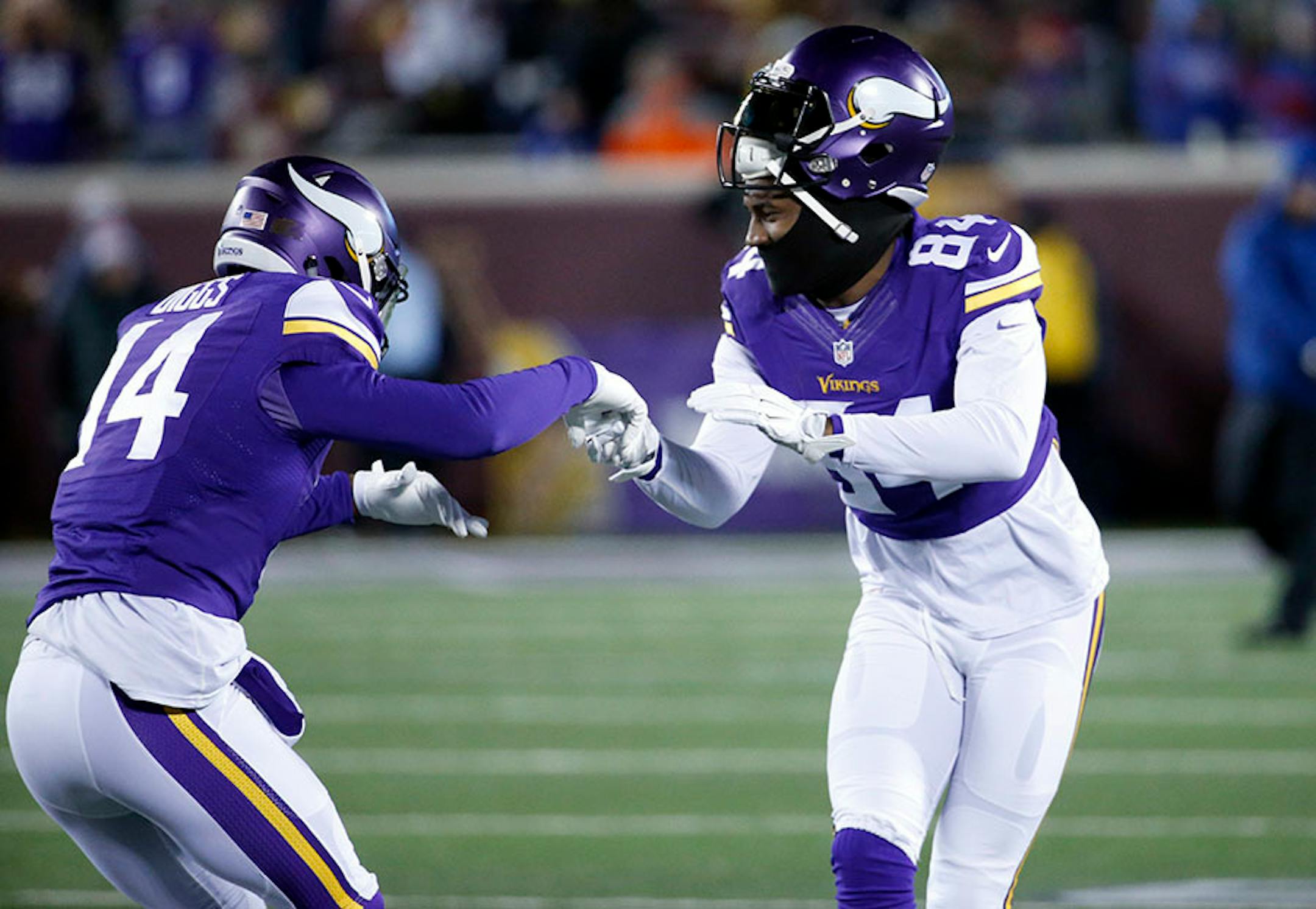 Minnesota Vikings wide receiver Stefon Diggs (14) and Vikings wide receiver Cordarrelle Patterson (84) react on the field during warm ups before an NFL football game against the New York Giants, Sunday, Dec. 27, 2015, in Minneapolis.