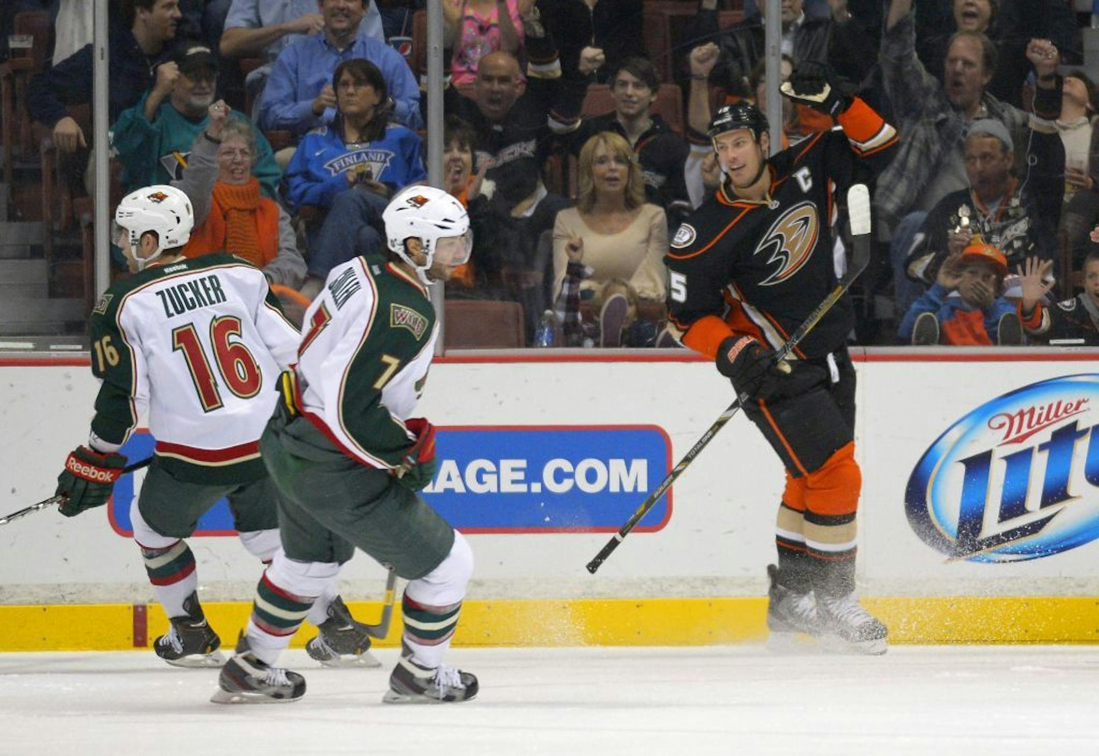 Anaheim center Ryan Getzlaf, right, celebrates his goal as Wild left wing Jason Zucker, left, and center Matt Cullen look on