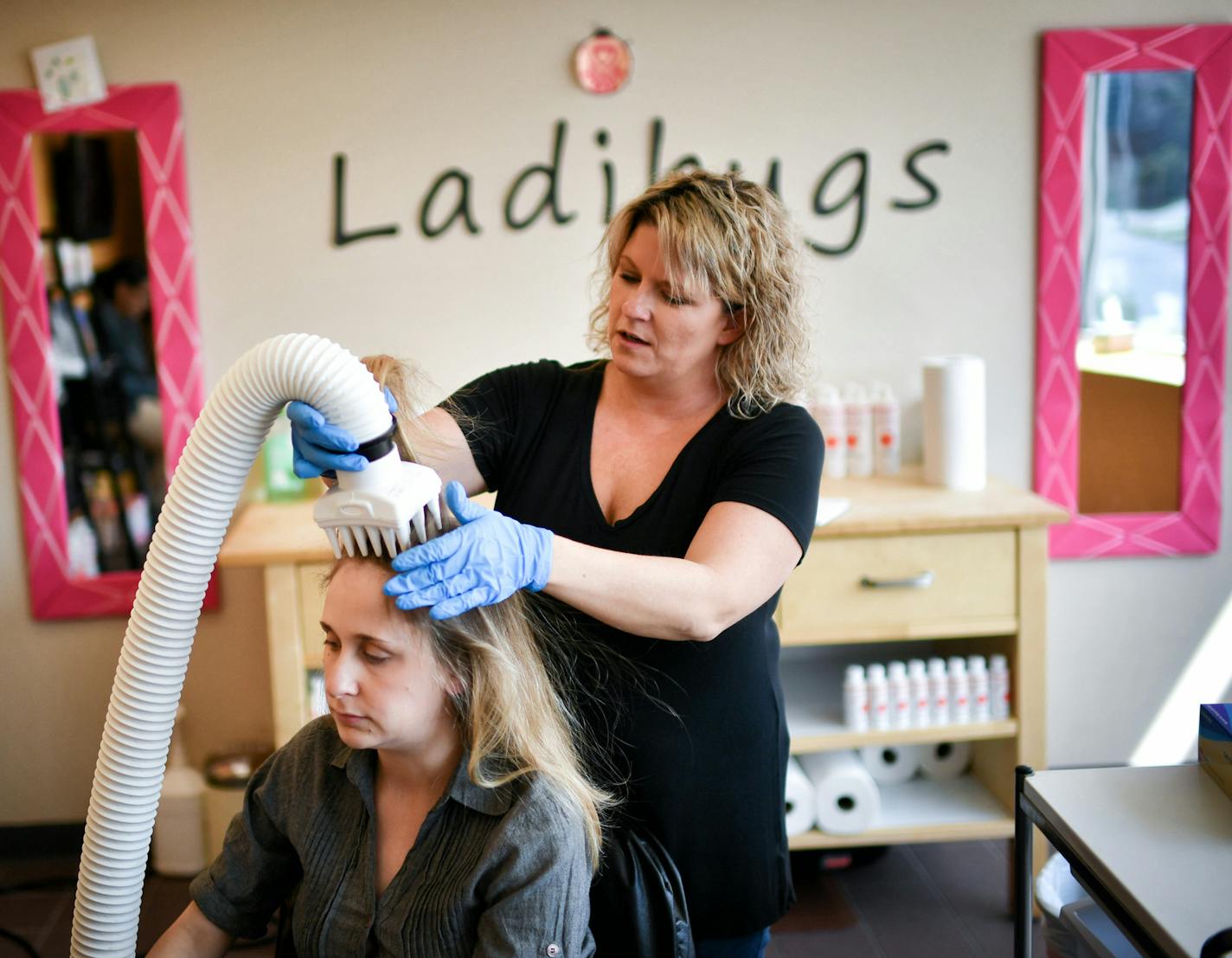 Ladibugs manager Christina Doran treated a client with an AirAll&#xe9; device which uses air hot enough to kill lice but not burn the patient. The client Mallory is a preschool teacher. ] GLEN STUBBE &#x2022; glen.stubbe@startribune.com Tuesday September 5, 2017 The latest approach to removing lice is to apply heat to the head with a device that looks like a vacuum hose. We investigate. Mallory has an appointment with the LadiBugs lice removal team. They will treat her using the heat device. Mal