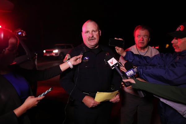 Fargo, N.D. Police Chief David Todd, center, and Clay County, Minn. sheriff Bill Bergquist, right, announced that kayakers found the body of Savanna G