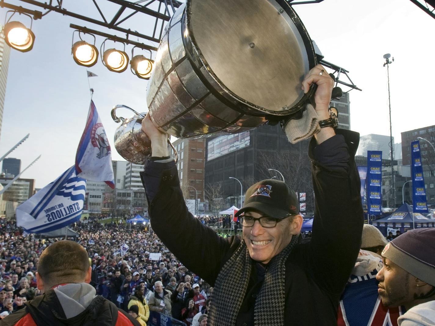 Montreal Alouettes head coach Marc Trestman holds up the Grey Cup for the fans during the victory parade Wednesday, Dec. 2, 2009, in Montreal. The Alouettes beat the Saskatchewan Roughriders last Sunday in the 97th CFL Grey Cup football game. (AP Photo/The Canadian Press, Ryan Remiorz) ORG XMIT: MIN2013082821261729