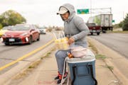 Rosa, a recent immigrant from Ecuador who did not want to give her last name, sold fruit from a median in Minneapolis.