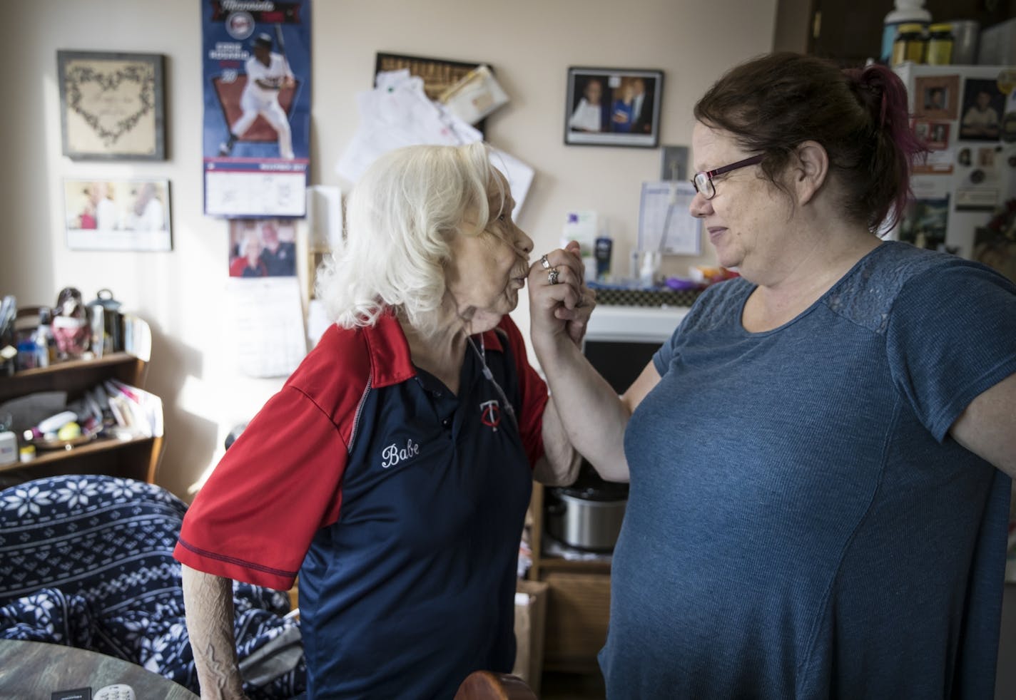 Elsa Lindberg kissed her daughter Dawn Lindberg's hand and told her how much she loves her. Dawn lives with her mom in two-week stretches, then goes home to Princeton, Minn., for a weekend.