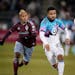 Minnesota United defender D.J. Taylor, right, pursues the ball with Colorado Rapids forward Michael Barrios during the first half Saturday