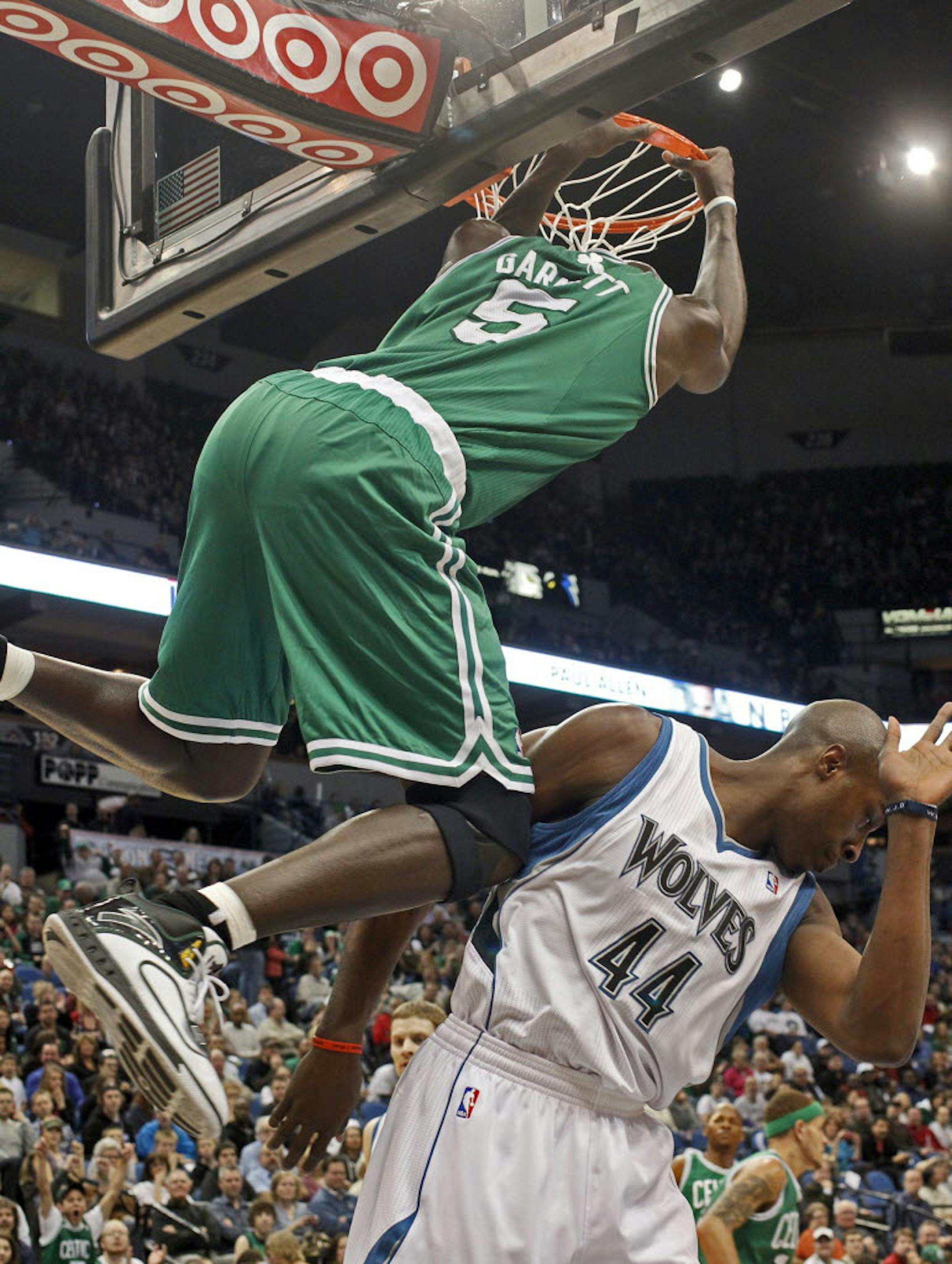 Boston's Kevin Garnett dunked over the Wolves' Anthony Tolliver.
