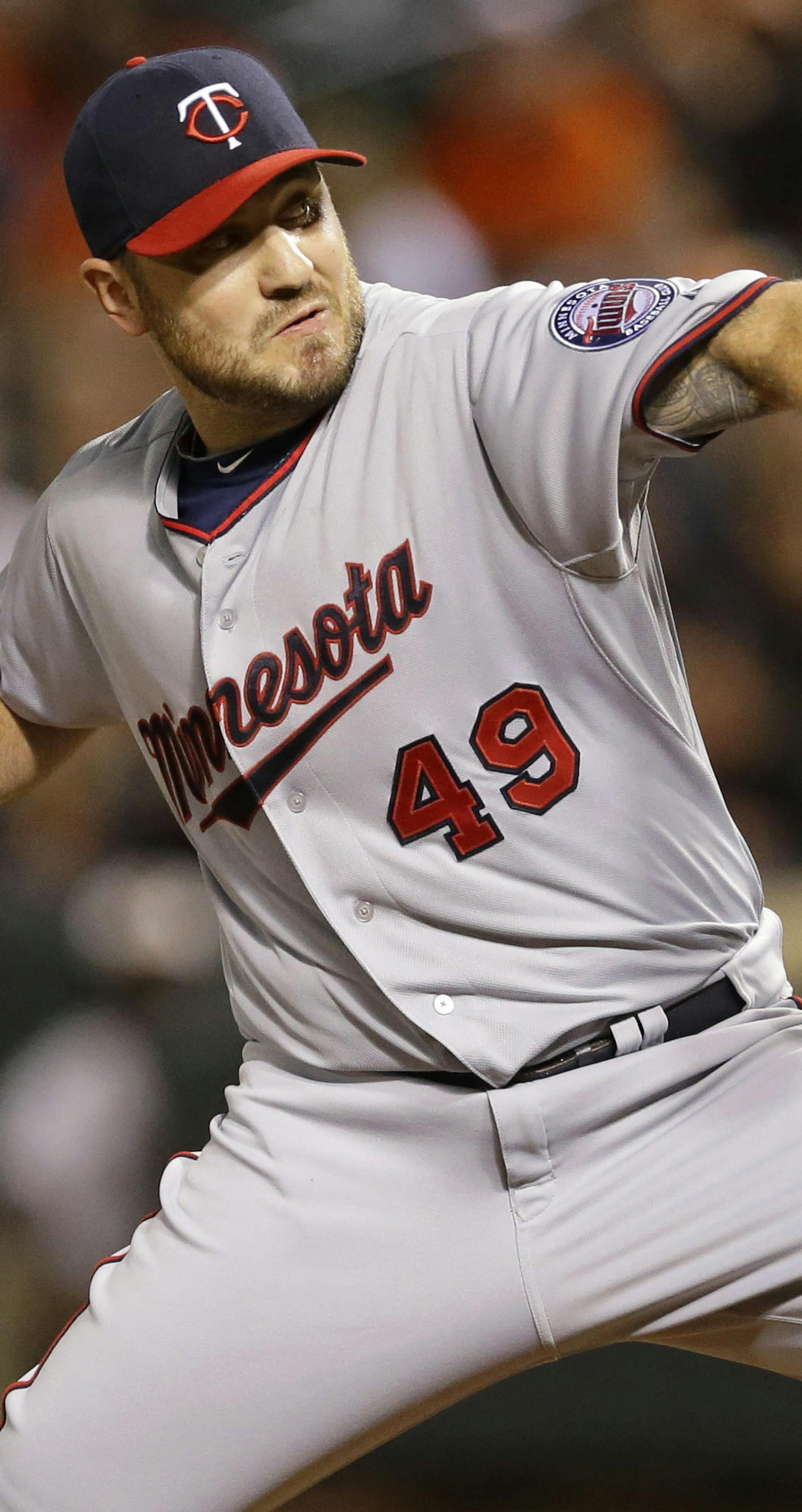 Minnesota Twins relief pitcher Kevin Jepsen throws to the Baltimore Orioles during the ninth inning of a baseball game, Friday, Aug. 21, 2015, in Baltimore. The Twins won 4-3. (AP Photo/Patrick Semansky)