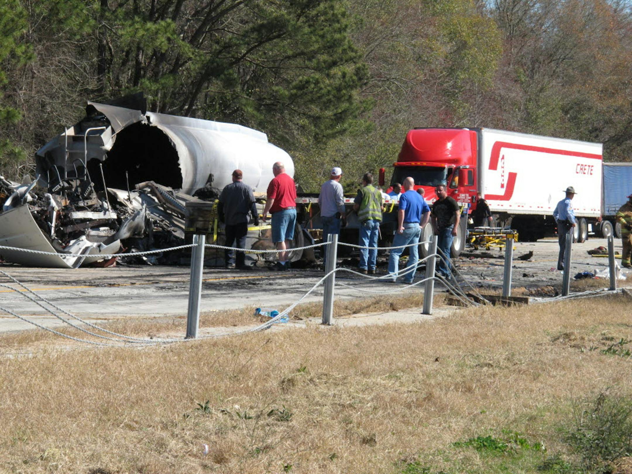 Crews work to clean up wreckage on Interstate 16, hours after 27 vehicles collided Wednesday near Montrose, Ga.
