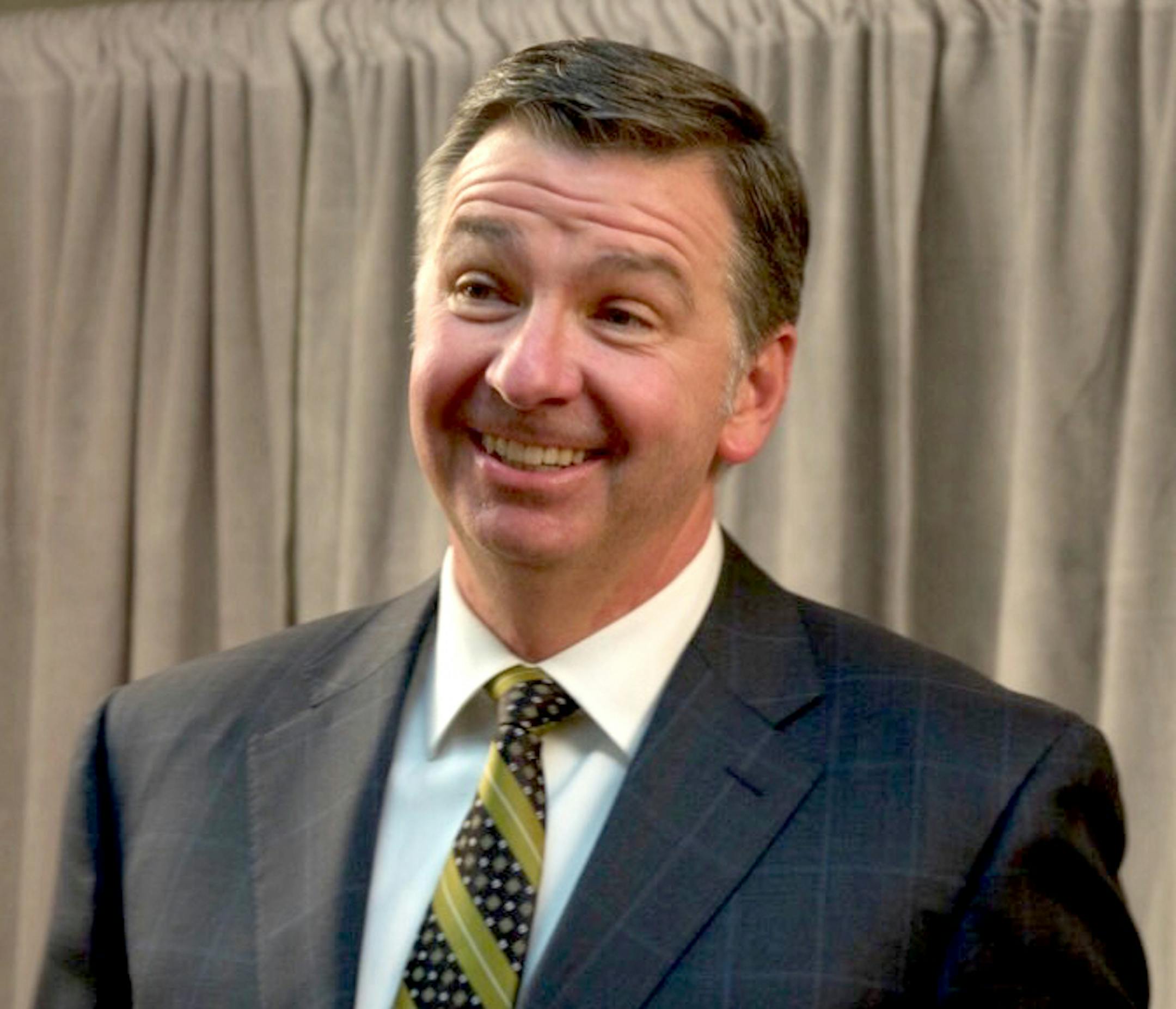 Jim Snee, Hormel's chief executive, shared a laugh with a shareholder outside the company's annual meeting Tuesday. ] Credit: Kristen Painter / Star Tribune