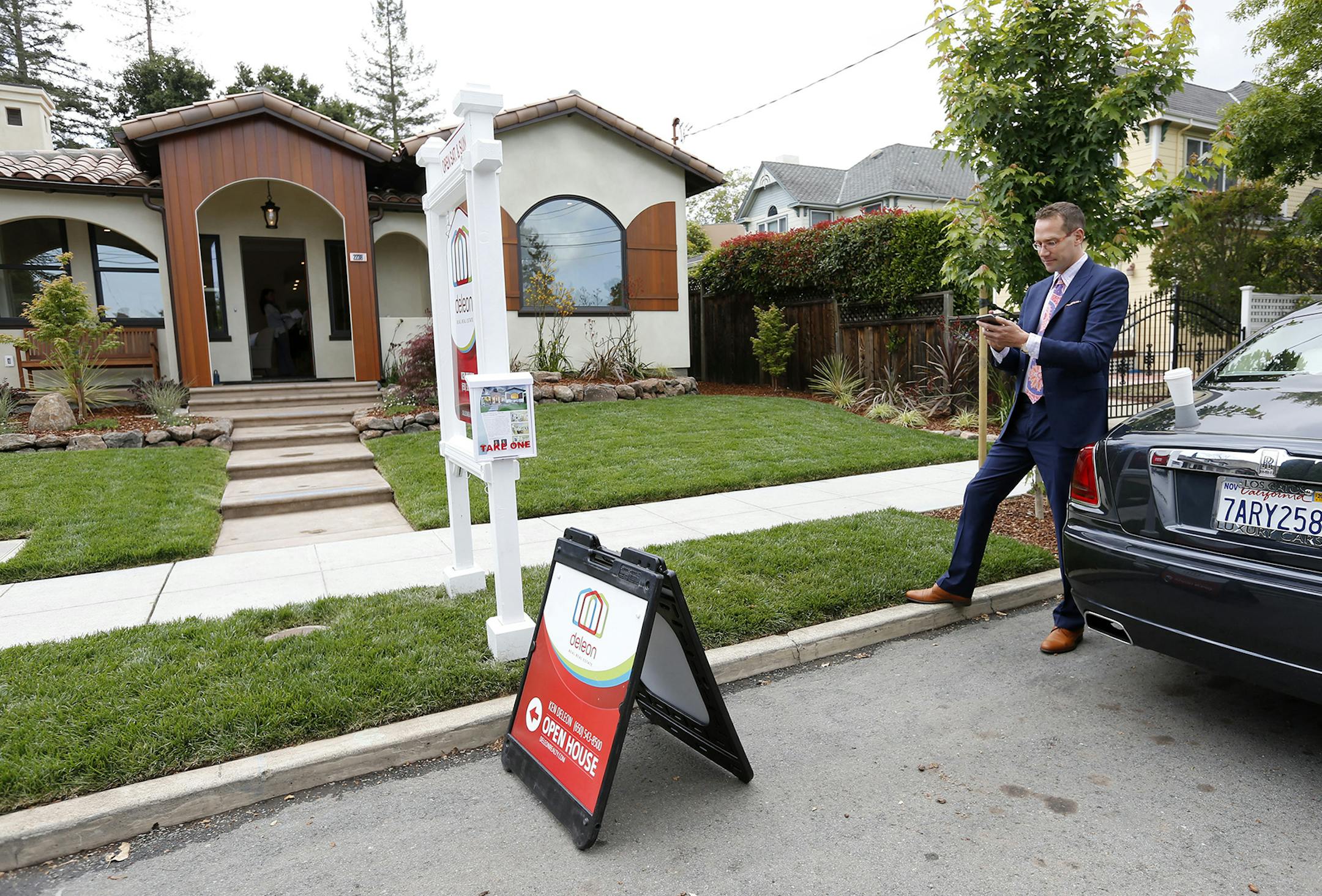 Ken DeLeon checks his phone messages during a brokers tour of a home he is selling in the College Terrace neighborhood on May 15, 2015 in Palo Alto, Calif. DeLeon, 42, is the founder of DeLeon Realty in Palo Alto. He is the top real estate agent in Silicon Valley and ranked as the number one real estate agent in the country. (Gary Reyes/Bay Area News Group/TNS) ORG XMIT: 1169509