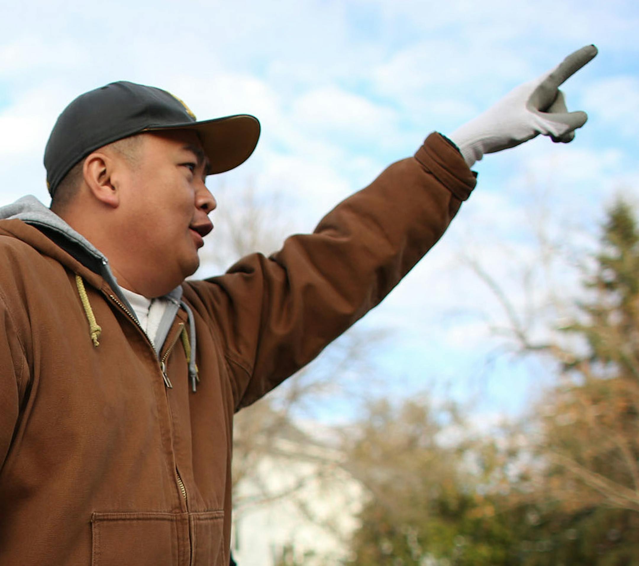 Blong Yang newly elected Minneapolis City Council member, waved to a supporter who honked his horn as he was taking down his lawn sign in North Minneapolis, Min., Wednesday, November 6, 2013 ] (KYNDELL HARKNESS/STAR TRIBUNE) kyndell.harkness@startribune.com