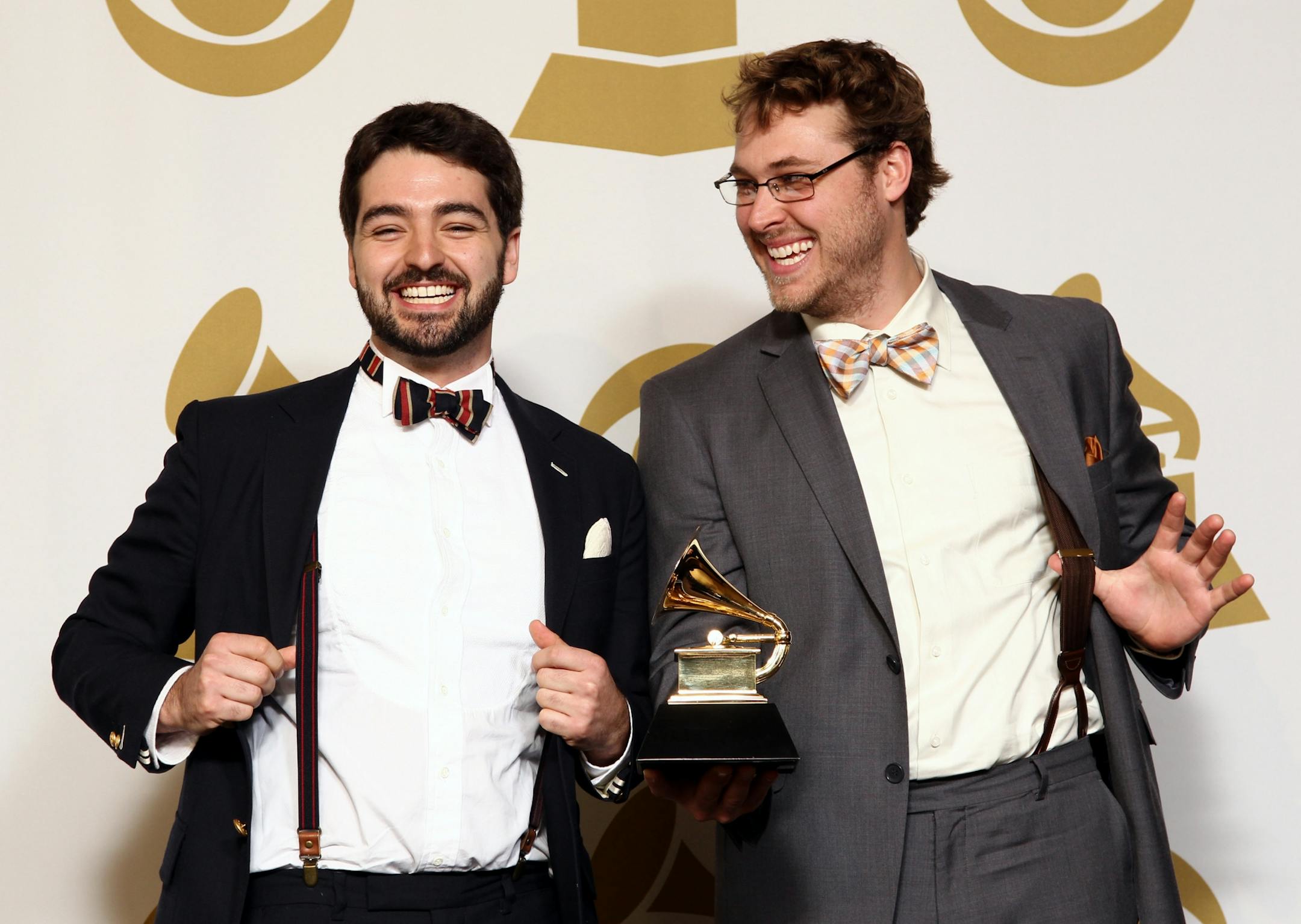 Justin Lansing, left, and Joe Mailander, of musical group The Okee Dokee Brothers, pose backstage with the best children's album award for "Can You Canoe?" at the 55th annual Grammy Awards on Sunday, Feb. 10, 2013, in Los Angeles.