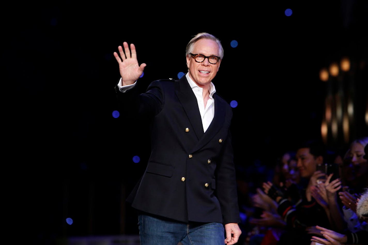 FILE - In a Monday, Feb. 15, 2016 file photo, designer Tommy Hilfiger acknowledges the audience after his Fall 2016 collection show during Fashion Week, in New York. Police in Greenwich, Connecticut are urging residents not to leave their keys inside their vehicles after a rash of Range Rover thefts. Fashion designer Tommy Hilfiger is among the Greenwich residents who have had their Range Rovers stolen in recent months. Hilfiger was targeted in late June. (AP Photo/Jason DeCrow, File)