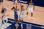 Minnesota Lynx guard Crystal Dangerfield (2) went up against Seattle Storm forward Candice Dupree (4) to score during the first quarter.