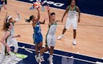 Minnesota Lynx guard Crystal Dangerfield (2) went up against Seattle Storm forward Candice Dupree (4) to score during the first quarter.
