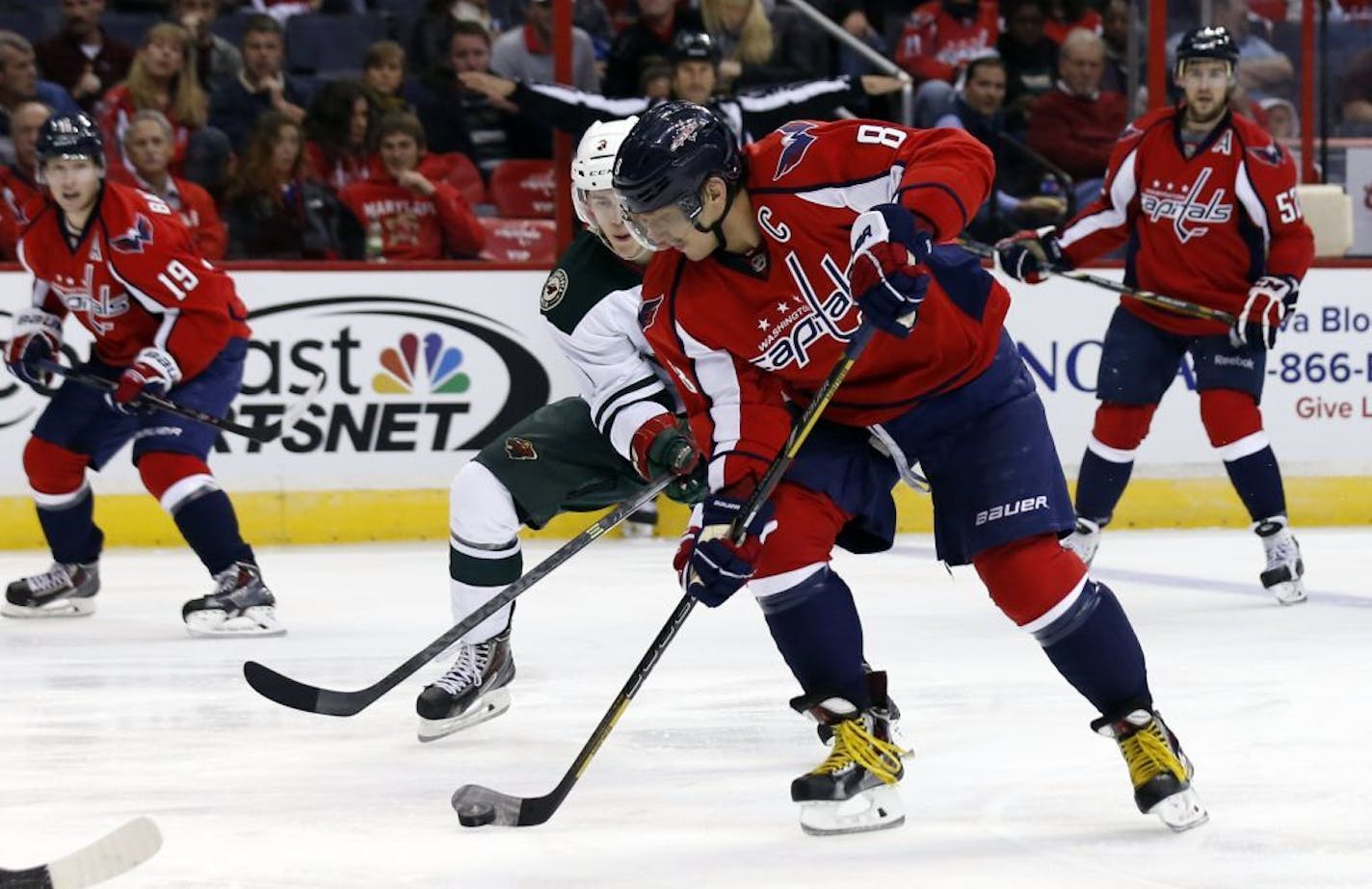 Minnesota Wild center Charlie Coyle (3) guards Washington Capitals right wing Alex Ovechkin (8), from Russia in the second period of an NHL hockey game, Thursday, Nov. 7, 2013, in Washington.