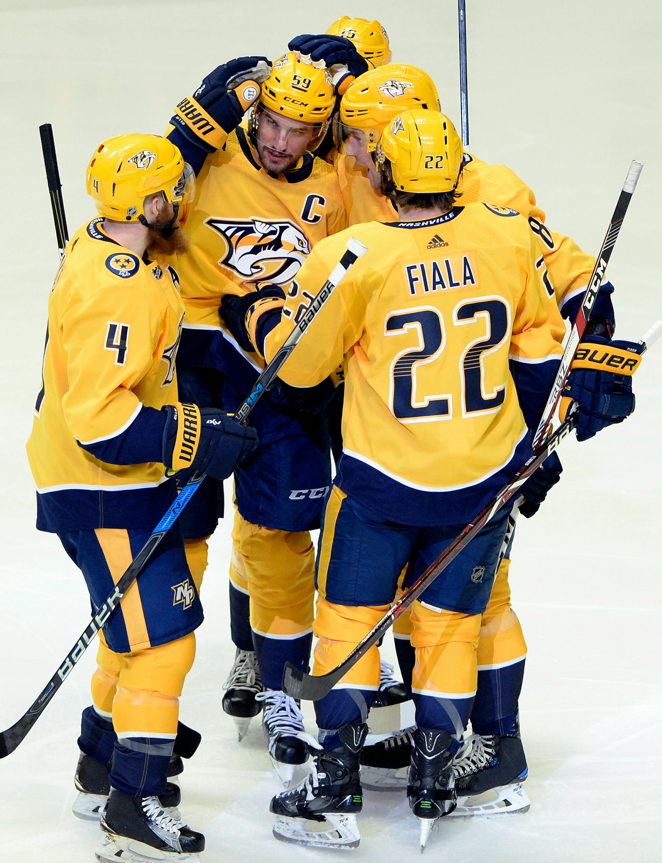 Nashville Predators defenseman Roman Josi (59), of Switzerland, celebrates with teammates after scoring a goal against the Minnesota Wild during the first period of an NHL hockey game Tuesday, March 27, 2018, in Nashville, Tenn. (AP Photo/Mark Zaleski)