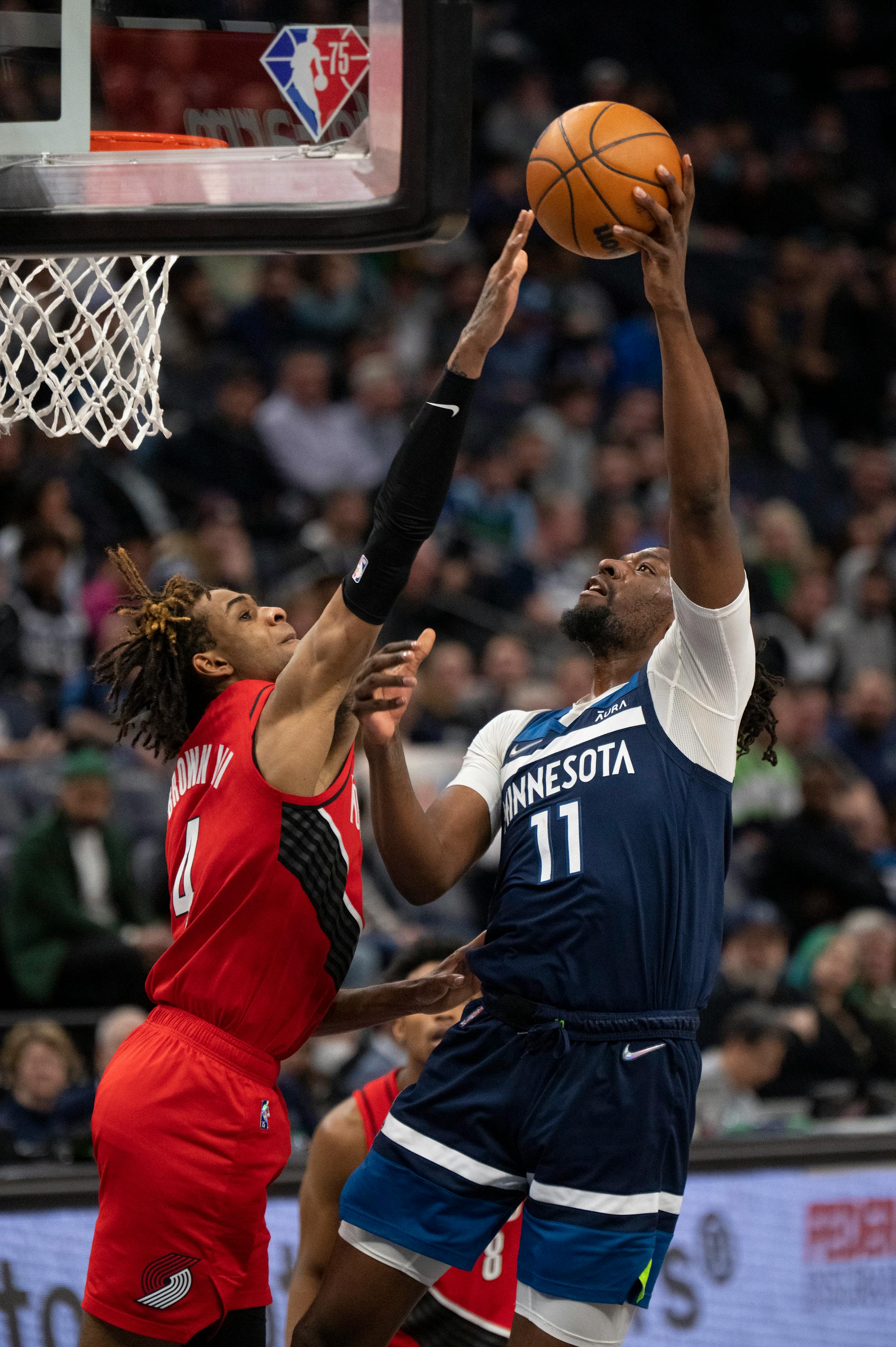 Minnesota Timberwolves center Naz Reid (11) was fouled by Portland Trail Blazers forward Greg Brown III (4) in the fourth quarter.