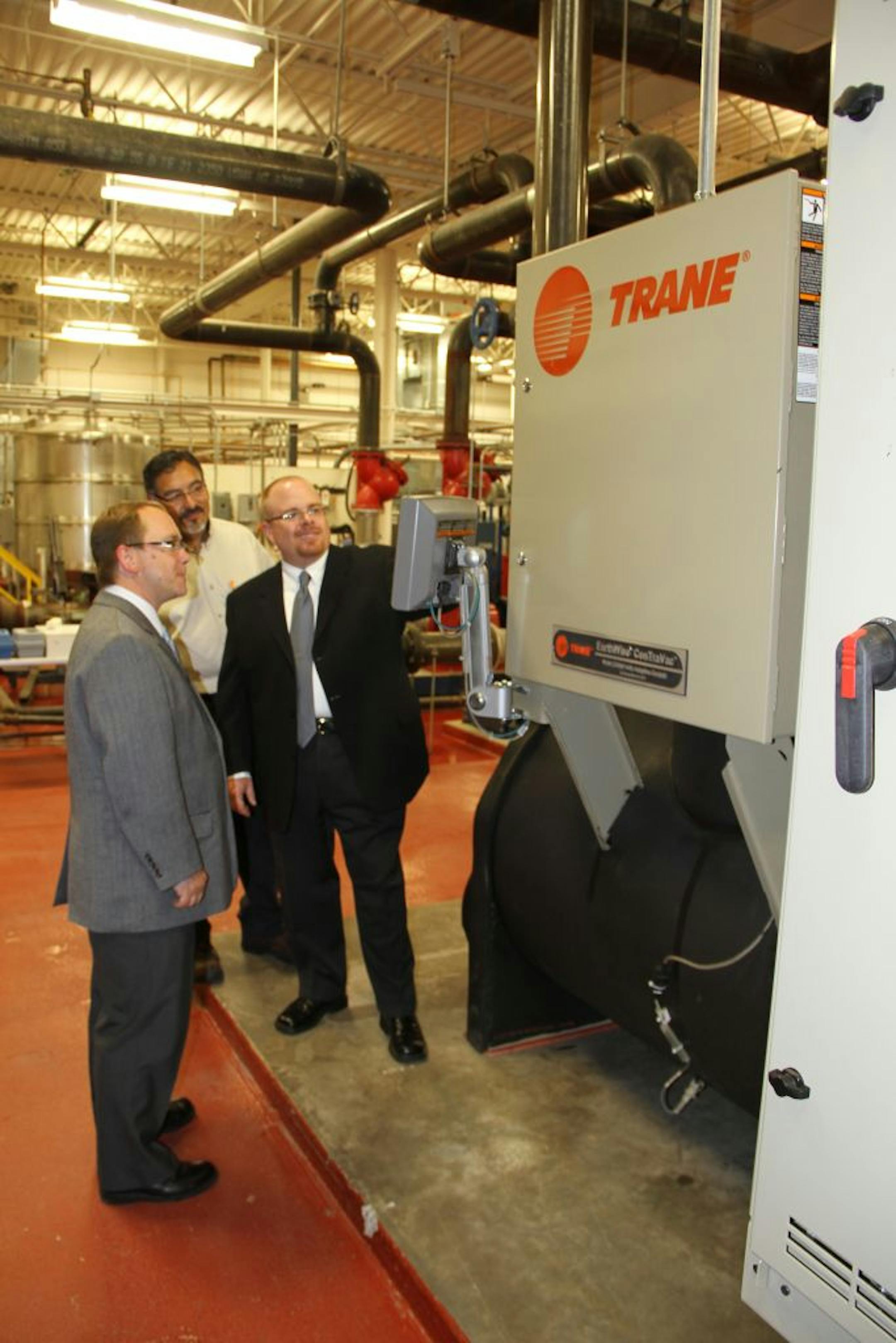 Shown here reviewing the capabilities of the new chilled water system are (from left): Charlie Holt, account manager for Trane, Victor Lopez, chief engineer for American Medical Systems and Matt Monicatti, manager of building operations for American Medical Systems.