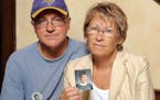 FILE - In this Aug. 28, 2009, file photo, Patty and Jerry Wetterling show a photo of their son Jacob Wetterling, who was abducted in October of 1989 i
