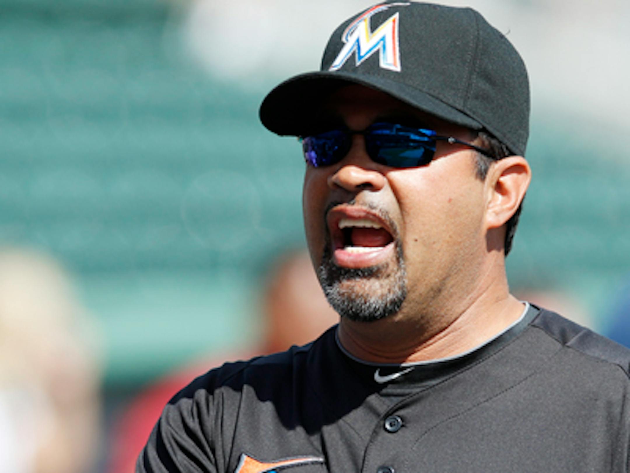 Miami Marlins manager Ozzie Guillen before facing the Boston Red Sox in a spring training baseball game in Fort Myers, Fla., Monday, March 12, 2012. (AP Photo/Charles Krupa)