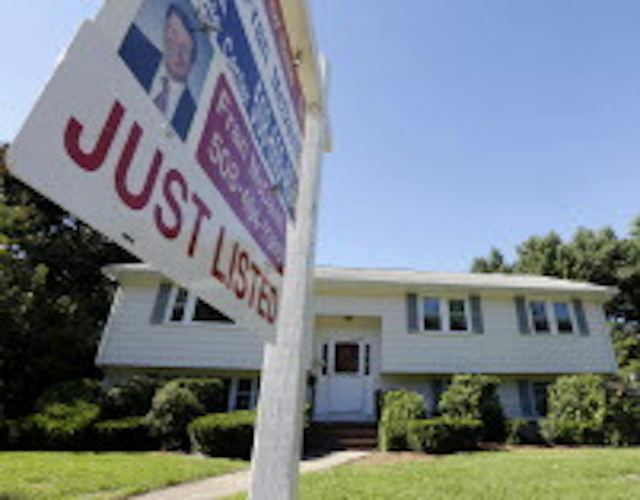 FILE - In this Wednesday, Sept. 18, 2013, file photo, a "For Sale" sign hangs in front of a house in Walpole, Mass. Americans bought fewer existing homes in September than the previous month, held back by higher mortgage rates and rising prices, the National Association of Realtors said Monday, Oct. 21, 2013. (AP Photo/Steven Senne) ORG XMIT: MIN2013102117221569 ORG XMIT: MIN1310211723231230