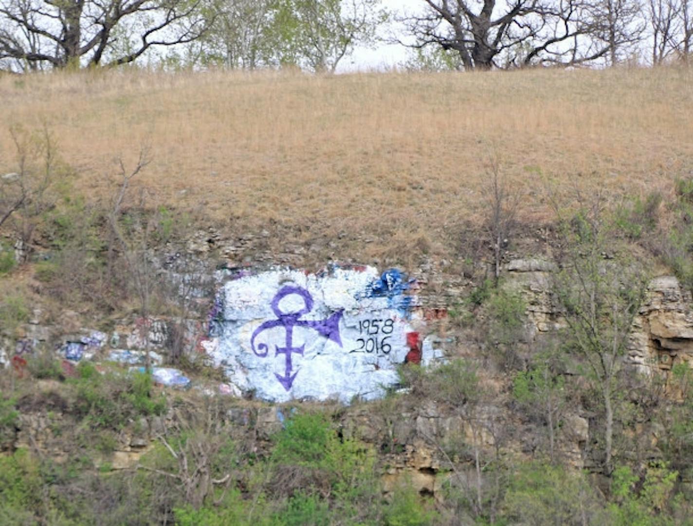 This purple Prince symbol, along with the years of his birth and death, that appeared on the bluff face shortly after the Minnesota artist�s death last week was removed by Monday. mandatory credit: Forum News Service photo.