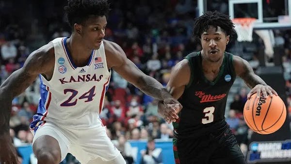 Elijah Hawkins drove to the basket against kansas during the NCAA men’s basketball tournament in March.