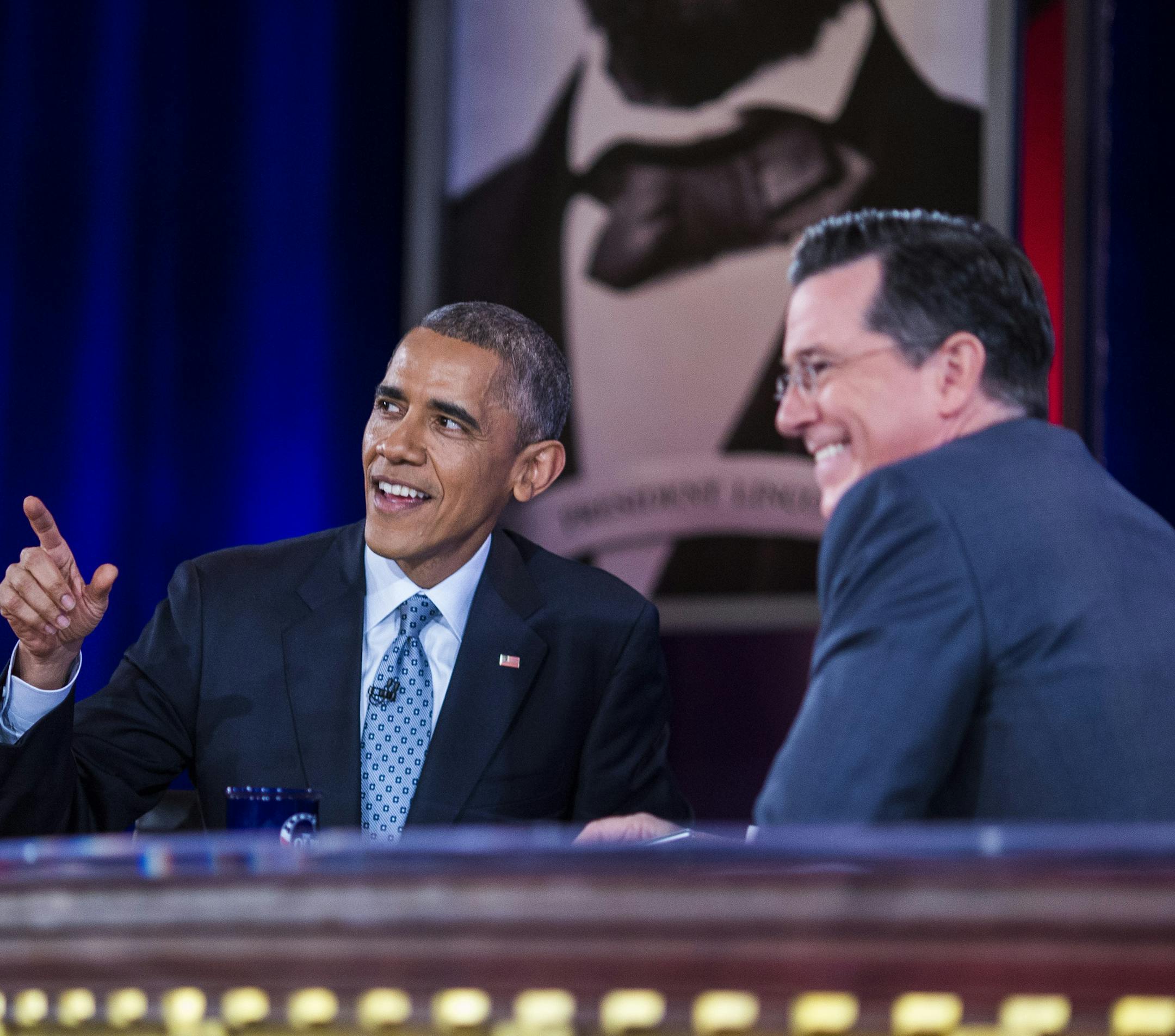 President Barack Obama talks with Stephen Colbert during recording of an upcoming epsiode of "The Colbert Report," Obama's third appearance on the show, in Lisner Auditorium at George Washington University in Washington, Dec. 8, 2014. The show's final episode is scheduled for Dec. 18, 2014, and Colbert will take over as host of "The Late Show," replacing David Letterman. (Jabin Botsford/The New York Times)