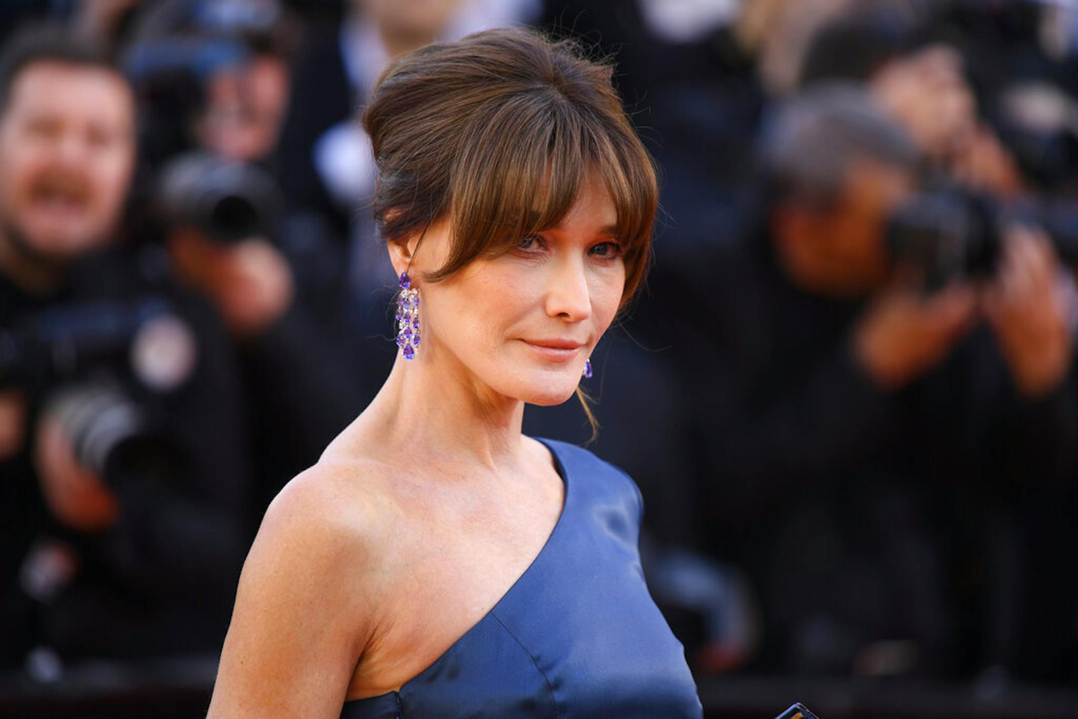 Former model Carla Bruni-Sarkozy poses for photographers upon arrival at the premiere of the film 'Les Miserables' at the 72nd international film festival, Cannes, southern France, Wednesday, May 15, 2019. (Photo by Arthur Mola/Invision/AP)