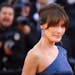 Former model Carla Bruni-Sarkozy poses for photographers upon arrival at the premiere of the film 'Les Miserables' at the 72nd international film fest