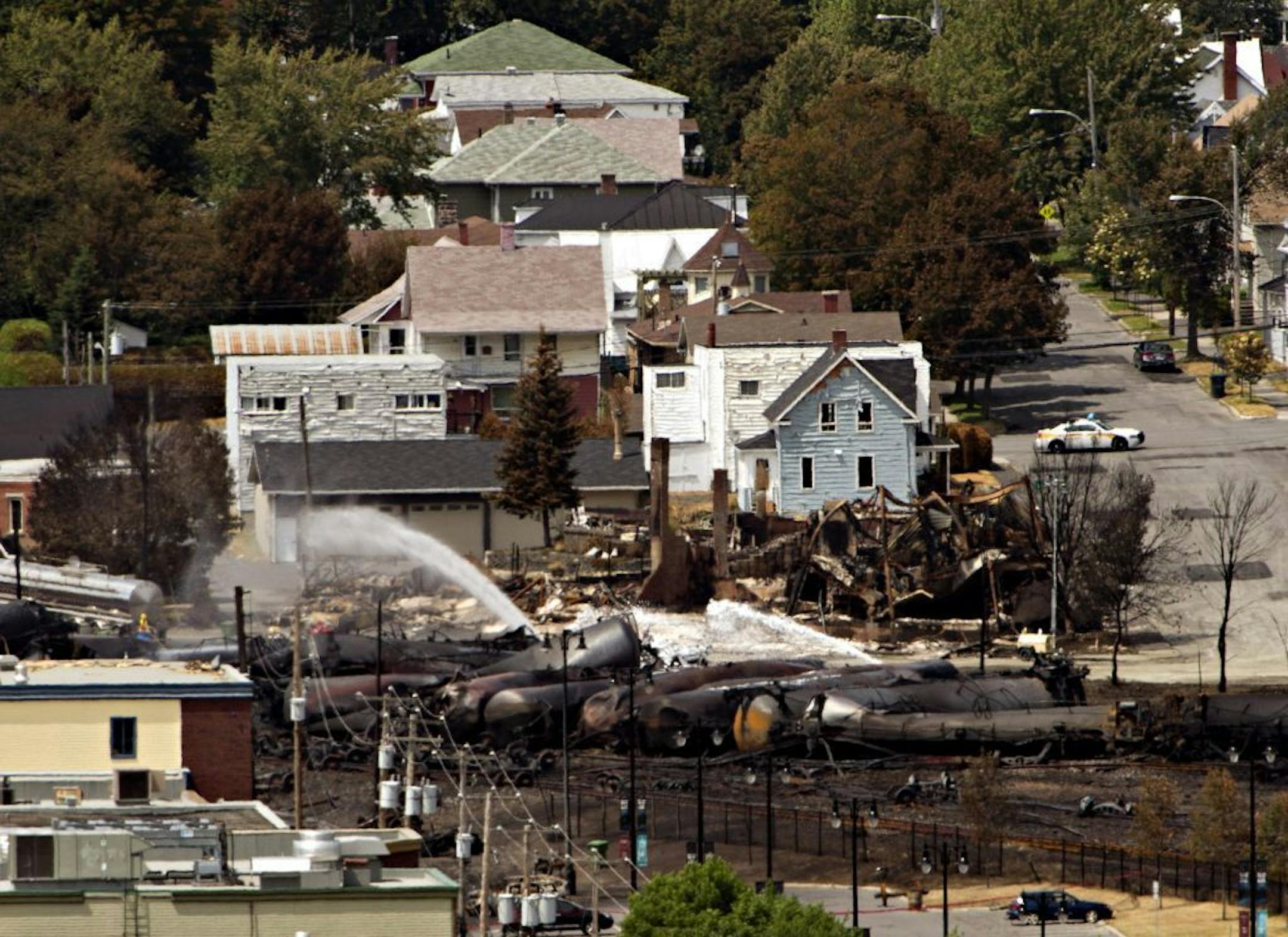 Wreckage is strewn through the downtown core in Lac-Megantic, Quebec, Monday, July 8, 2013, after a train derailed, igniting tanker cars carrying crude oil early Saturday.