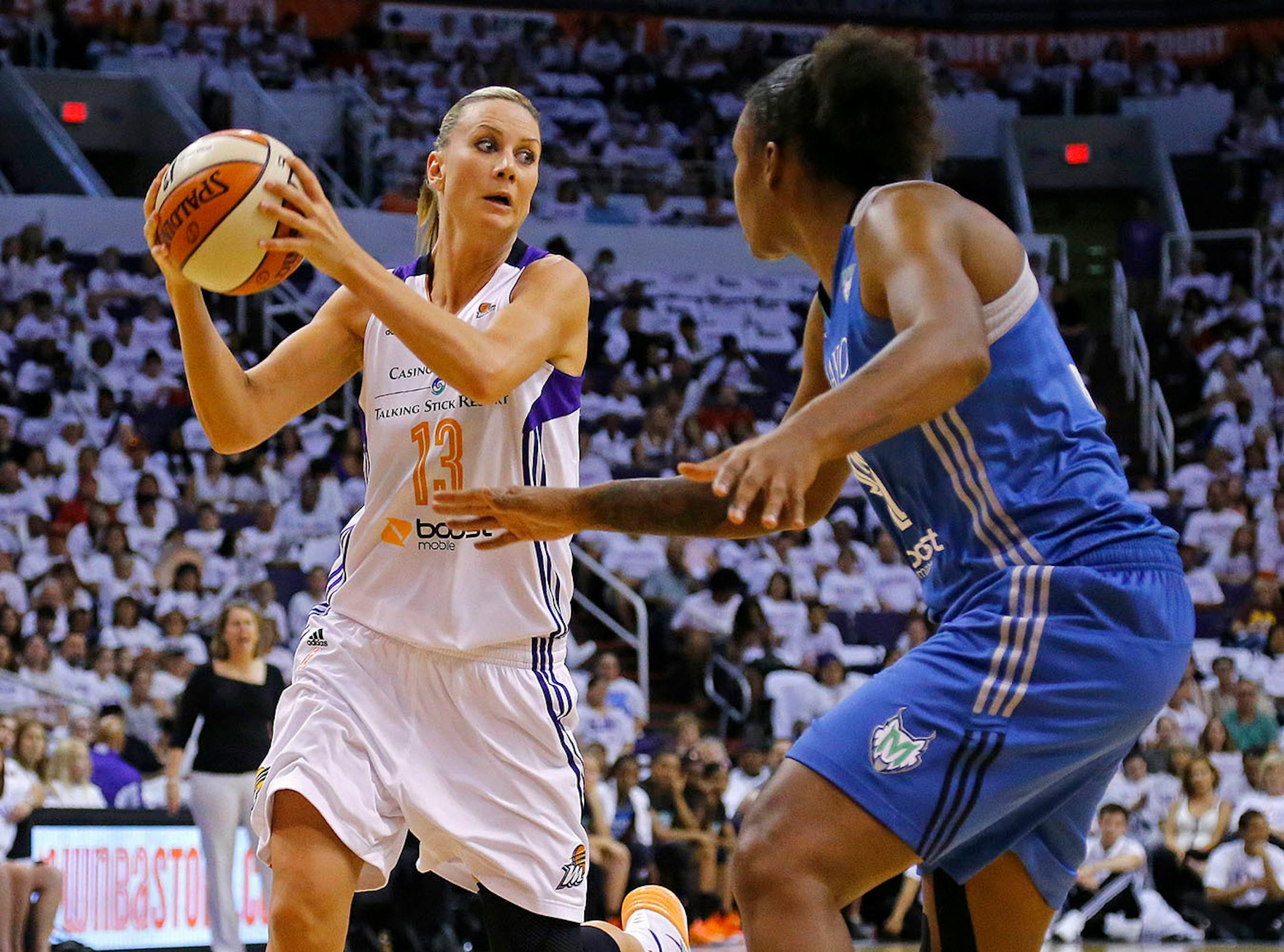 Phoenix Mercury forward Penny Taylor (13) looks to pass against the Minnesota Lynx during the first half of Game 1 of the WNBA Western Conference finals Friday, Aug. 29, 2014 in Phoenix, Ariz.