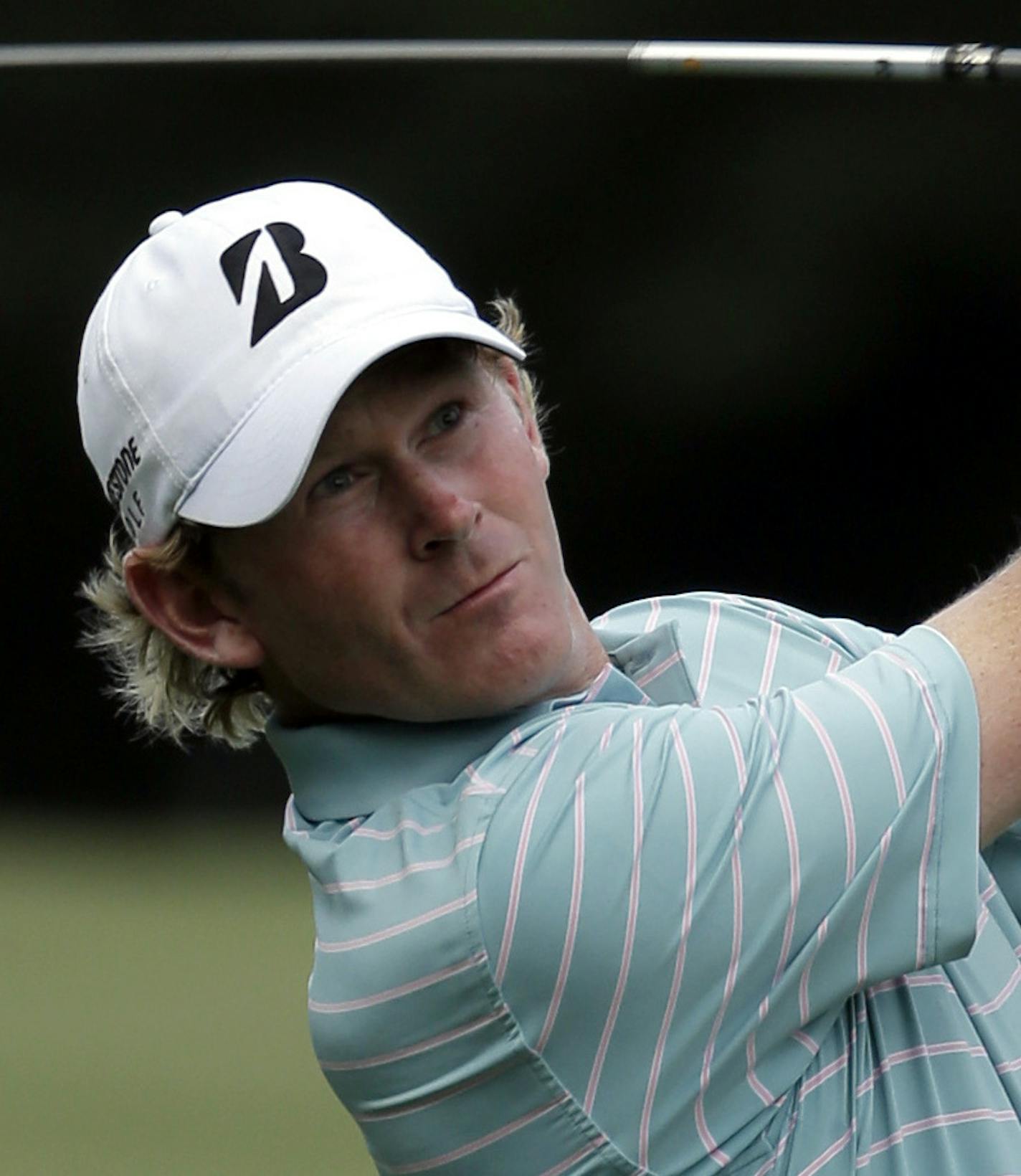 Brandt Snedeker watches his approach shot on the 18th hole during the first round of the Wyndham Championship golf tournament in Greensboro, N.C., Thursday, Aug. 18, 2016. (AP Photo/Chuck Burton) ORG XMIT: NCCB123