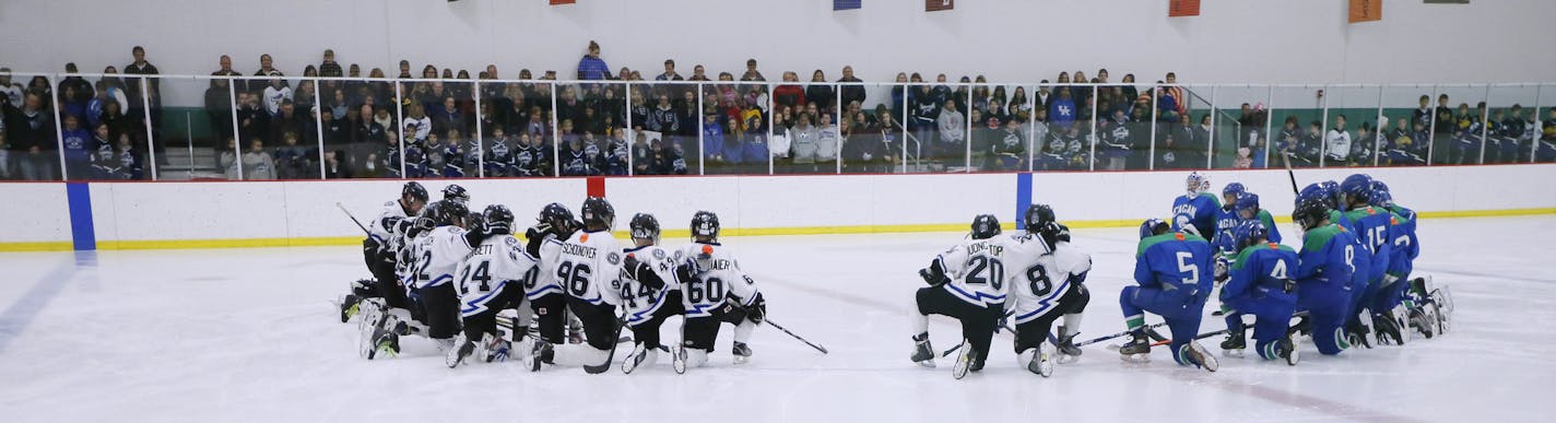 Matthew Schoonover wearing his brother Patrick 's jersey (96) with teammates along with players form Eagan held an moment of silence for Patrick Schoonover who died Friday after collapsing on the ice. ] Jerry Holt Jerry.holt@startribune.com