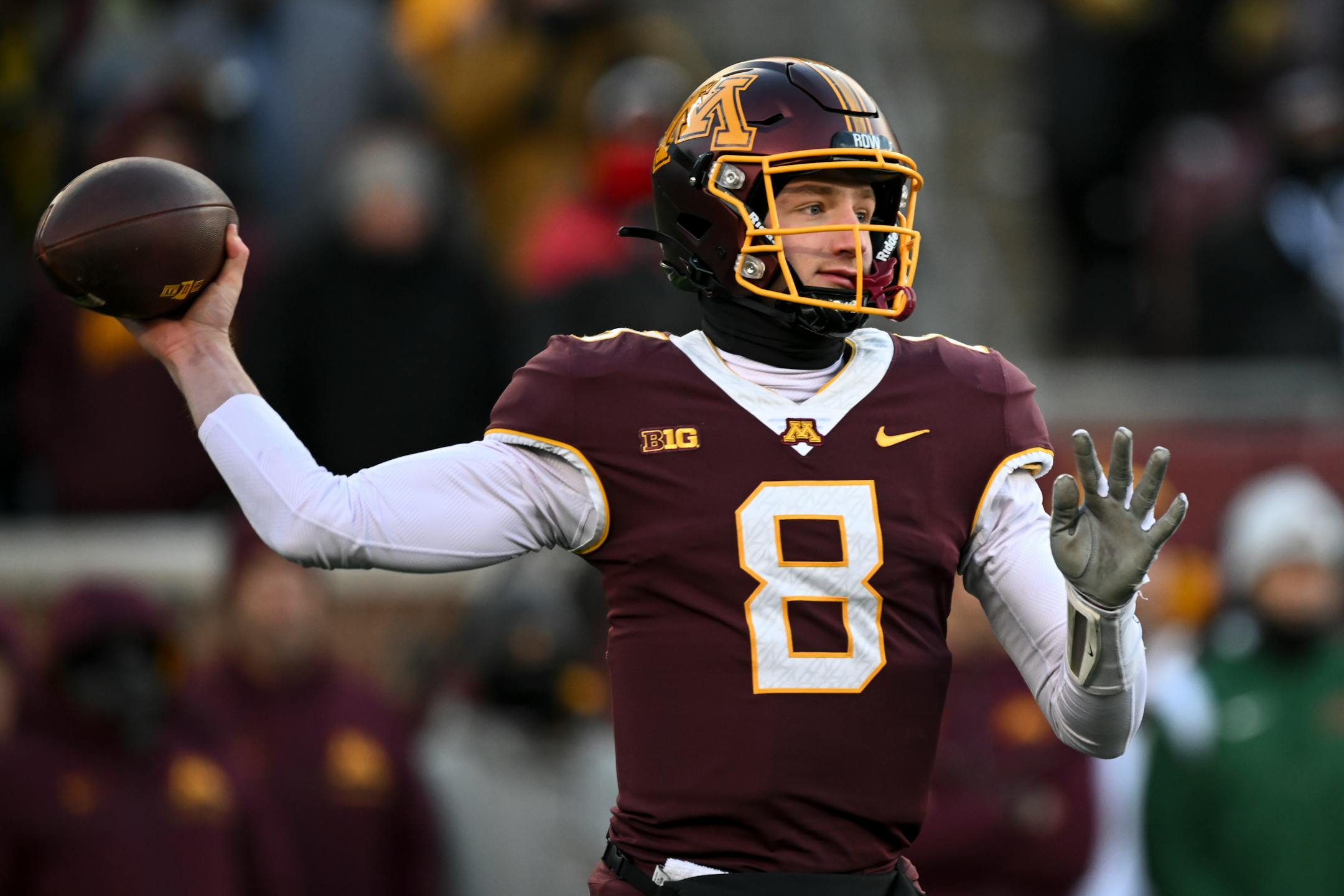 Minnesota Gophers quarterback Athan Kaliakmanis (8) throws a pass against the Iowa Hawkeyes during the first half.