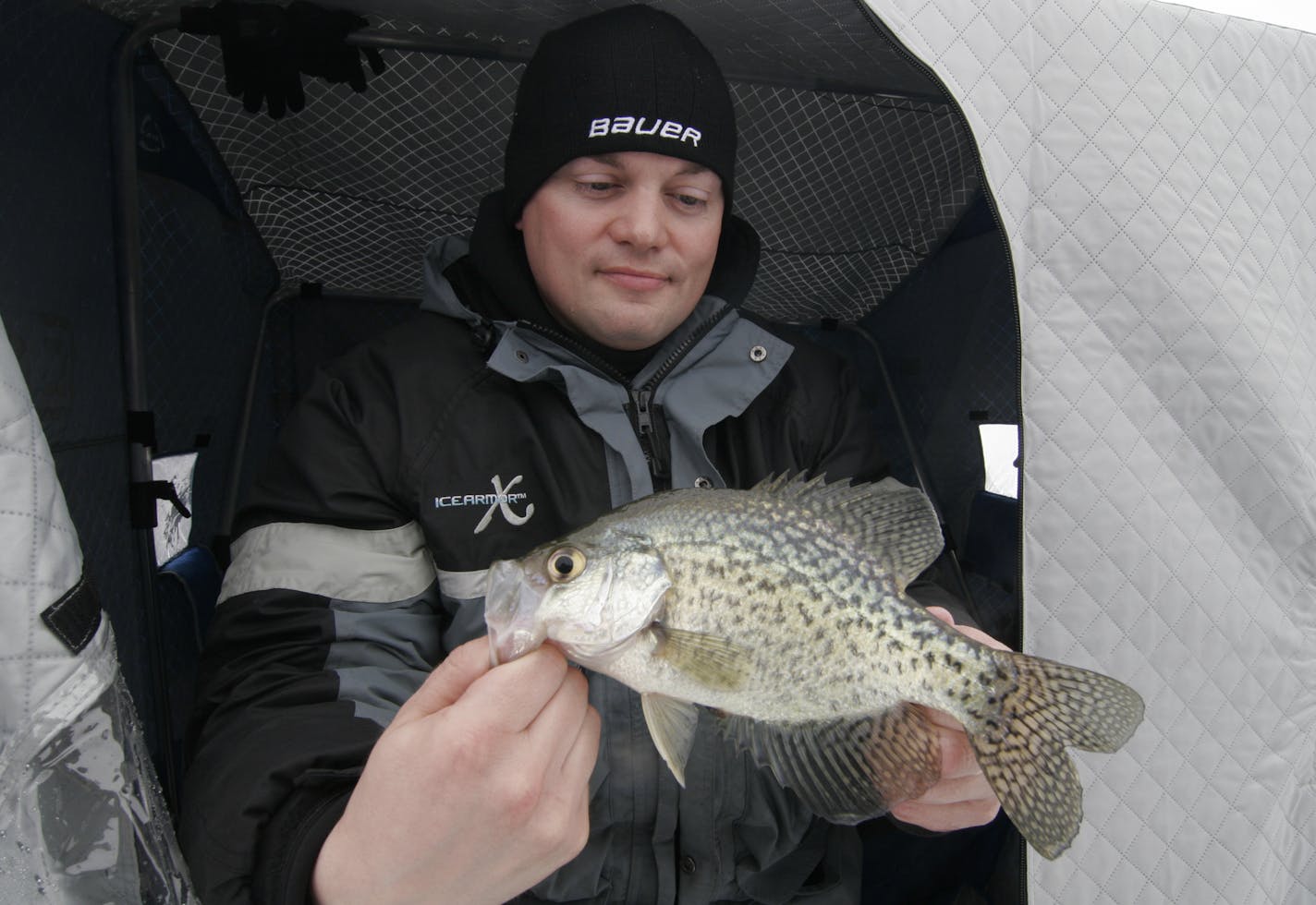 Travis Luebben of Albertville held a 10-inch crappie he caught last weekend on Pelican Lake. &#x201c;You can always catch fish here,&#x2019;&#x2019; he said. However, the fishing is slated to disappear as the DNR focuses on attracting ducks to the lake.