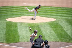 East Ridge pitcher Jacob Reigert (4) hurls to finish out the Class 4A state baseball semifinal against Forest Lake at CHS Field in St. Paul on Friday.